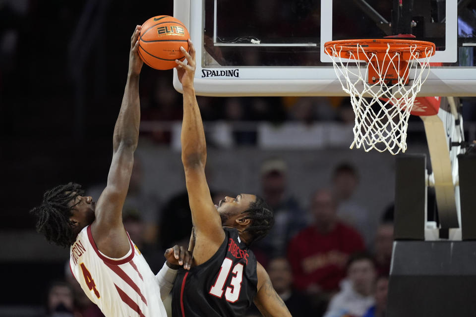 Houston forward J'Wan Roberts (13) blocks a shot by Iowa State guard Demarion Watson (4) during the first half of an NCAA college basketball game, Tuesday, Jan. 9, 2024, in Ames, Iowa. (AP Photo/Charlie Neibergall)