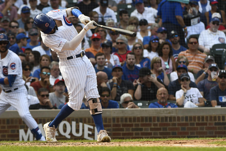 Chicago Cubs' Nicholas Castellanos hits a double during the fifth inning of a baseball game against the St. Louis Cardinals, Friday, Sept. 20, 2019, in Chicago. (AP Photo/Matt Marton)