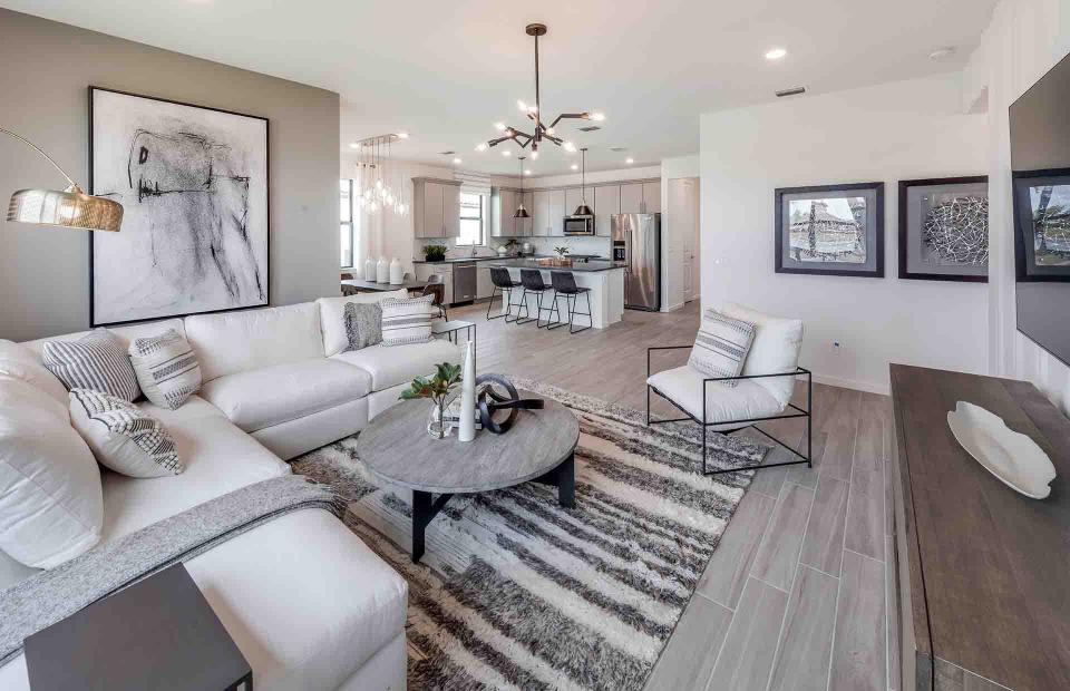 Modern, open-concept floor plans in Verde provide spacious gathering areas that seamlessly flow from sitting and dining spaces to well-appointed kitchens and lanais.