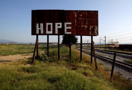 A rusty sign stands next to railway tracks where the refugees and migrants makeshift camp was at the Greek-Macedonian border near the village of Idomeni, Greece, August 10, 2016. REUTERS/Alexandros Avramidis