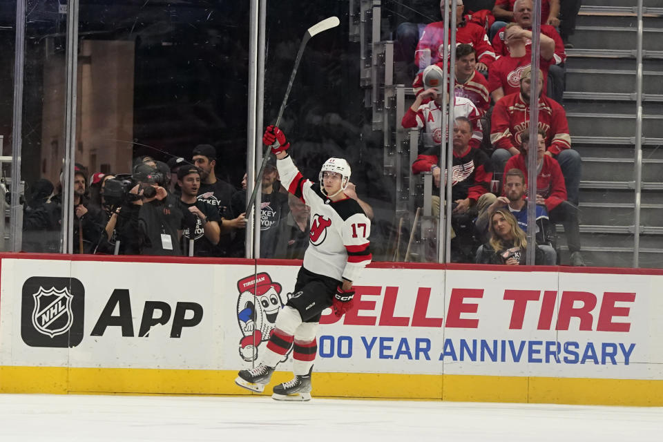 New Jersey Devils center Yegor Sharangovich reacts after his goal during the second period of an NHL hockey game against the Detroit Red Wings, Tuesday, Oct. 25, 2022, in Detroit. (AP Photo/Carlos Osorio)