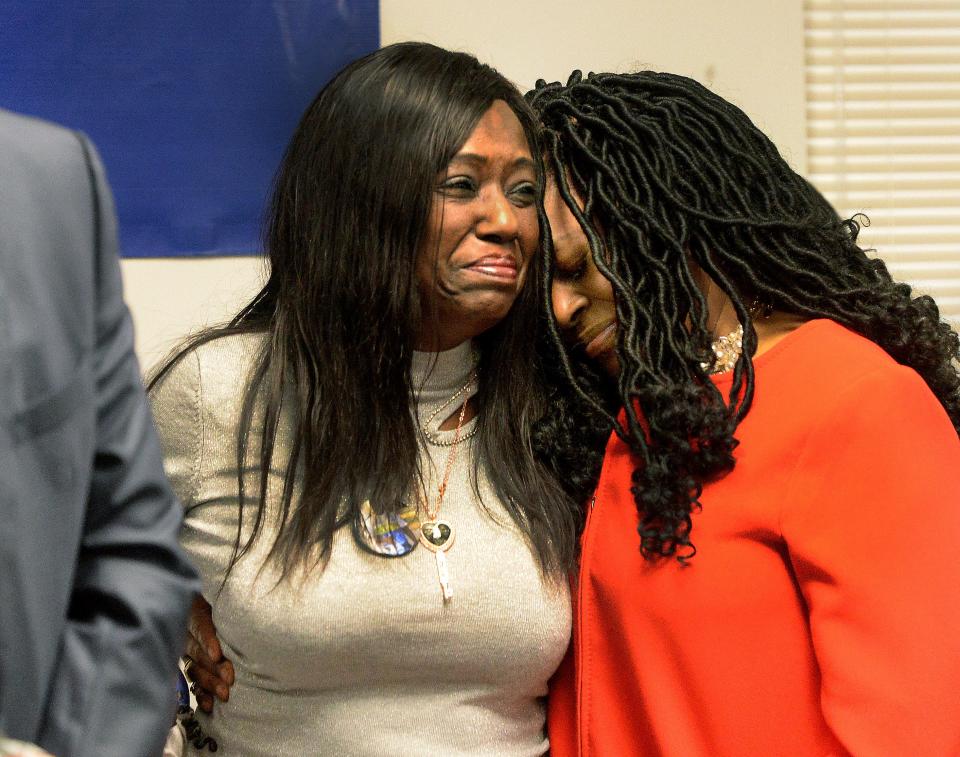 Rosena Washington, mother of Earl Moore Jr., left, and NAACP Springfield branch president and state director Teresa Haley, comfort each other during a press conference, Thursday Jan. 19, 2023 at the NAACP in Springfield.