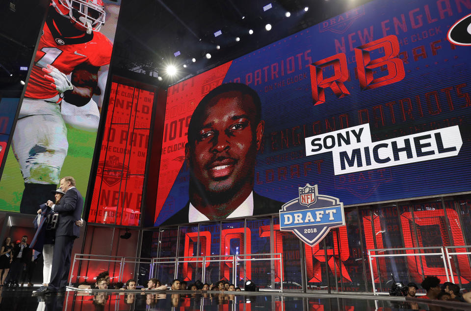 Commissioner Roger Goodell poses with a fan after the New England Patriots selected Georgia's Sony Michel. (AP) 