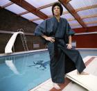 <p>Singer Tom Jones poses by his swimming pool wearing a robe in 1970. </p>
