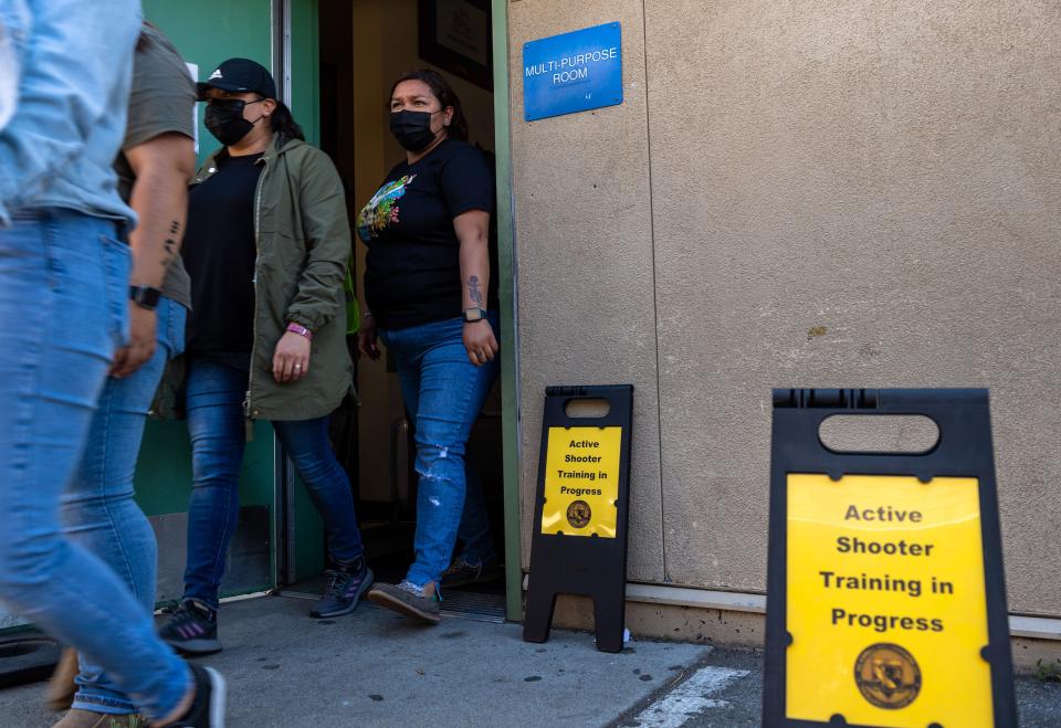 Alisal Union School District employees walk out of the cafeteria during an active shooter training at Virginia Rocca Barton School in Salinas, Calif., on Thursday, June 9, 2022. 