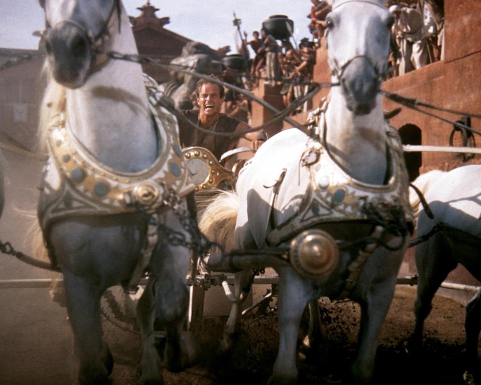 Charlton Heston (1923-2008), US actor, in costume and riding a horsedrawn chariot in a publicity still issued for the film, 'Ben-Hur', 1959. The historical drama, directed by William Wyler (1902-1981), starred Heston as 'Judah Ben-Hur'. (Photo by Silver Screen Collection/Getty Images)