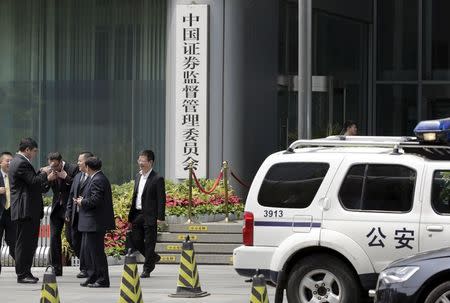 A police vehicle is seen parked outside the headquarters building of China Securities Regulatory Commission in Beijing, July 9, 2015. REUTERS/Jason Lee