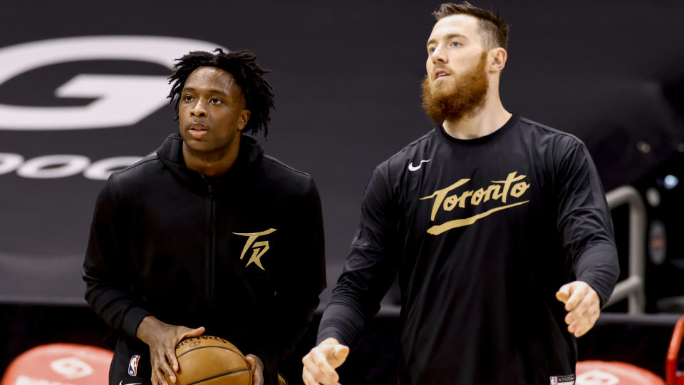 TAMPA, FLORIDA - APRIL 06: OG Anunoby #3 and Aron Baynes #46 of the Toronto Raptors warms up prior to the game against the Los Angeles Lakers at Amalie Arena on April 06, 2021 in Tampa, Florida.NOTE TO USER: User expressly acknowledges and agrees that, by downloading and or using this photograph, User is consenting to the terms and conditions of the Getty Images License Agreement.  (Photo by Douglas P. DeFelice/Getty Images)