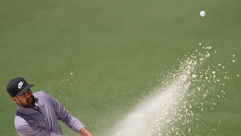 Tony Finau hits from the bunker on the second hole during second round at the Masters golf tournament at Augusta National Golf Club Friday, April 12, 2024, in Augusta, Ga. (AP Photo/George Walker IV)