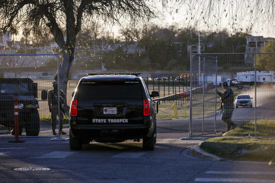 Texas Department of Public Safety officers guard an entrance to Shelby Park on Thursday, Jan. 11, 2024, in Eagle Pass, Texas. The Justice Department on Friday, Jan. 12, asked the Supreme Court to order Texas to stop blocking Border Patrol agents from a portion of the U.S.-Mexico border where large numbers of migrants have crossed in recent months, setting up another showdown between Republican Gov. Greg Abbott and the Biden administration over immigration enforcement. (Sam Owens /The San Antonio Express-News via AP)