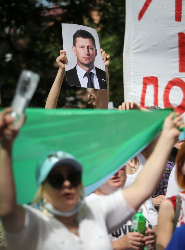 People take part in a rally in support of arrested governor Sergei Furgal in Khabarovsk