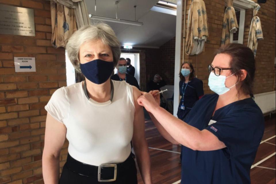 <p>Theresa May posted a picture of her recieving her first dose</p> (Twitter)