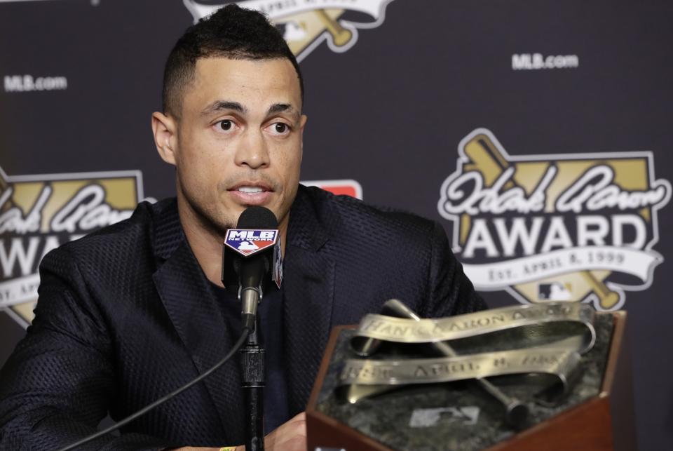 Miami Marlins’ Giancarlo Stanton talks after winning the National League Hank Aaron Award at baseball’s World Series Wednesday, Oct. 25, 2017, in Los Angeles. (AP Photo/Alex Gallardo)