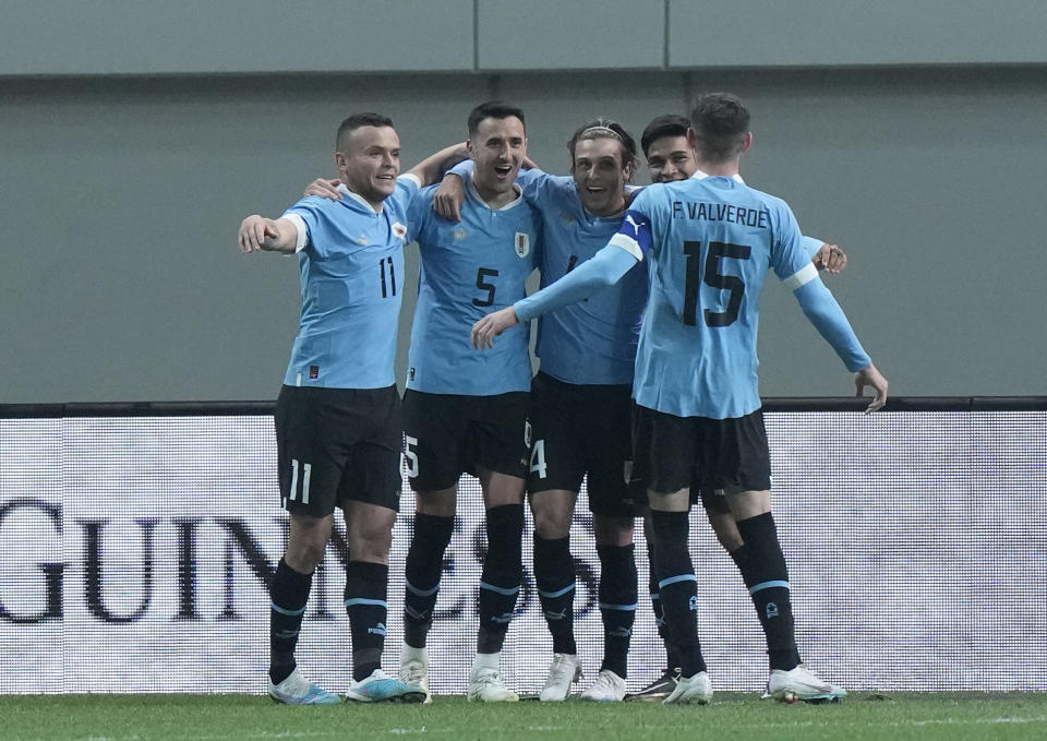 Uruguay's Matias Vecino Falero, second from left, celebrates with his teammate after scoring a goal during an international friendly soccer match between South Korea and Uruguay in Seoul, Sough Korea, Tuesday, March 28, 2023. (AP Photo/Ahn Young-joon)
