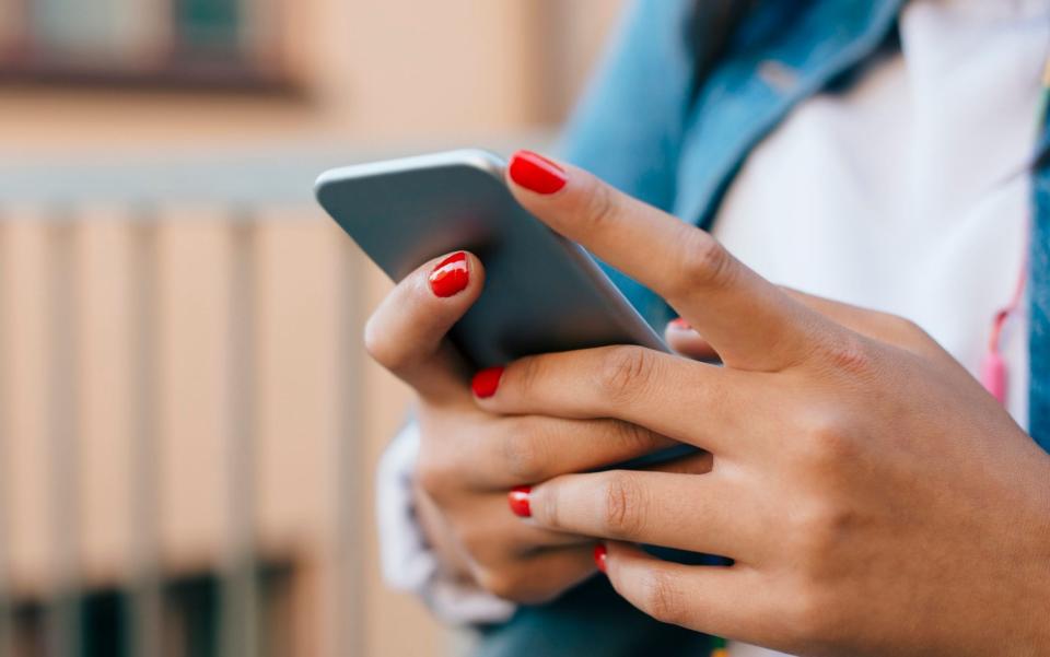 Stock image of a teenage girl using her phone - Maskot/Getty Images Contributor 