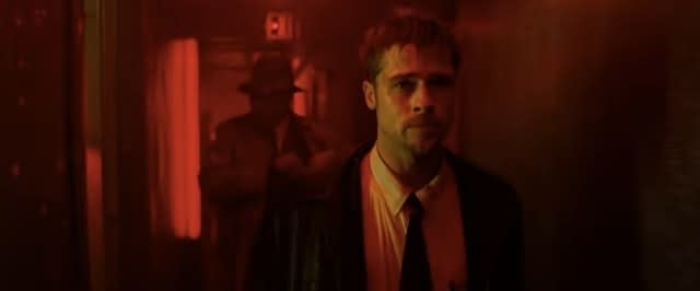 Mills and Somerset walking down a red-lit hallway in "Se7en"