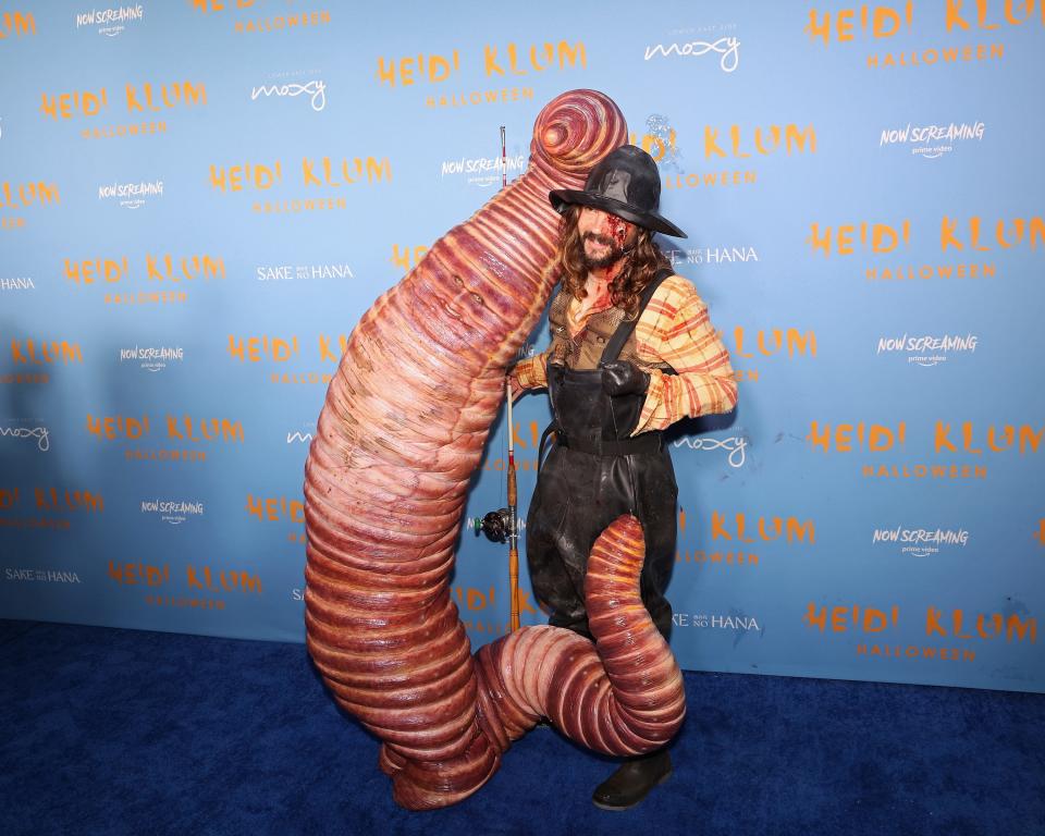 Heidi Klum dressed like a worm and Tom Kaulitz dressed like a fisherman