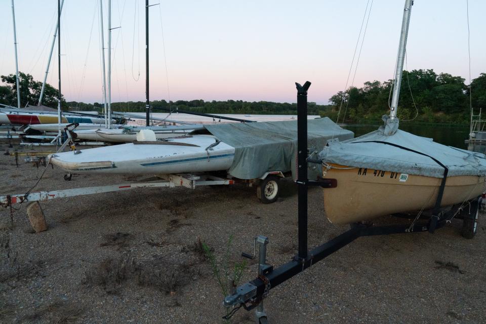 Club boats sit covered on trailers at the boatyard at the Shawnee Yacht Club. Members of the club are able to use the vessels with proper memberships.