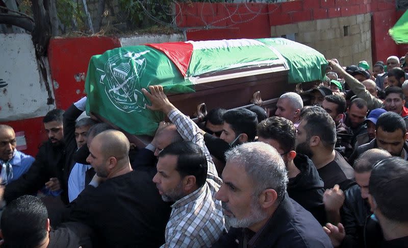 Men carry the coffin of a man during his funeral in Tyre