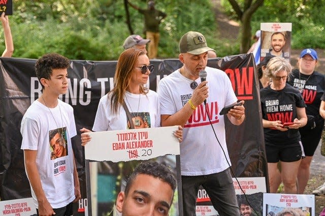 Tenafly's Adi Alexander (right) addressed a rally in New York's Central Park Sunday on behalf of his son, Edan, and other hostages captured in the Oct. 7 Hamas terror attack on Israel. His wife Yael and son Roy looked on.