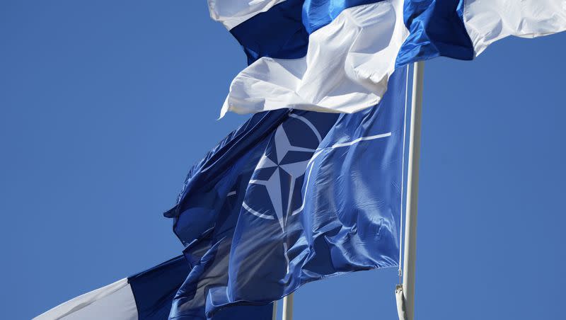 NATO and Finland flags flutter over the building of Ministry of Foreign Affairs in Helsinki, Finland, Tuesday, April 4, 2023. Finland prepared to make its historic entry into NATO Tuesday, a step that doubles the Western alliance’s border with Russia and ends decades of non-alignment for the Nordic nation.