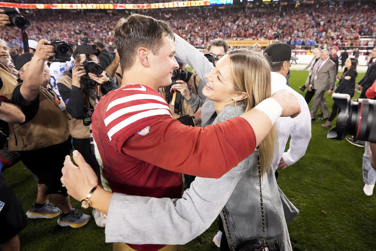 Brock Purdy hugs his fiancé, Jenna Brandt (Mark J. Terrill / AP)