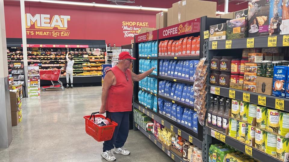 Customer Tom Bacon looks at coffee products at a Grocery Outlet store in Pleasanton, Calif., on Thursday, Sept. 15, 2022. "Best before” labels are coming under scrutiny as concerns about food waste grow around the world. Manufacturers have used the labels for decades to estimate peak freshness. But “best before” labels have nothing to do with safety, and some worry they encourage consumers to throw away food that’s perfectly fine to eat. (AP Photo/Terry Chea)