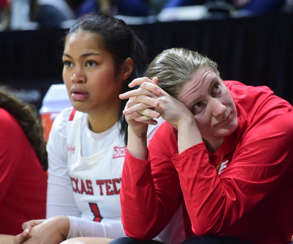 Texas Tech's Katie Ferrell, right, looks at the scoreboard during the game against Kansas State on March 9. The senior sat out while in concussion protocol but is expected back Thursday against UTEP.