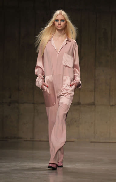 <b>LFW AW13: Topshop Unique </b><br><br>Would you wear this pink pyjama style jumpsuit?<br><br>© PA