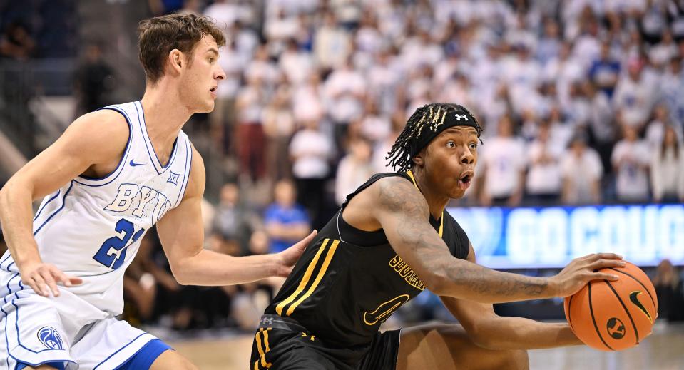 Brigham Young Cougars guard Trevin Knell (21) defends Southeastern Louisiana Lions guard Kam Burton (0) as BYU and SE Louisiana play at the Marriott Center in Provo on Wednesday, Nov. 15, 2023. | Scott G Winterton, Deseret News