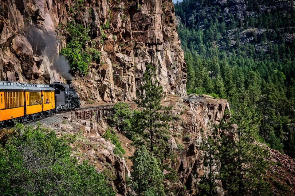 The Durango Silverton Narrow Gauge Railroad takes passengers along sheer cliffs and around mountain bends.