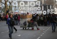 Demonstrators march during a protest against the government’s economic measures in Buenos Aires