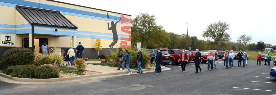 Voters begin to enter the storm shelter at the Ben Geren Regional Park as early voting begins in the 2020 election.