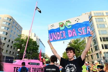 Climate change activists block traffic at an intersection near the White House in Washington