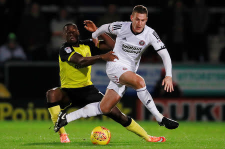 Soccer Football - Championship - Burton Albion vs Sheffield United - Pirelli Stadium, Burton, Britain - November 17, 2017 Sheffield United's Paul Coutts in action with Burton Albion's Lucas Akins Action Images/Jason Cairnduff