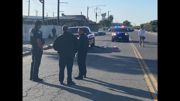 Officers investigate where a man was shot on G Street near Church Avenue in Fresno on Wednesday, April 19, 2023.