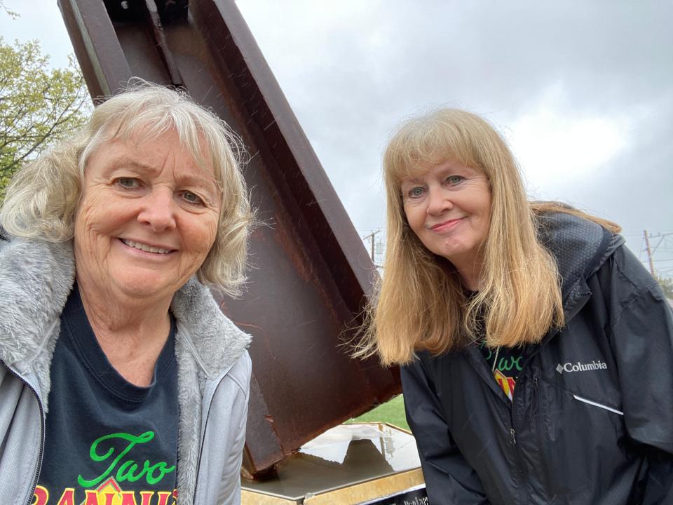 Beth Sobiloff and Louisa Clerici at the 911 Memorial in Acushnet, while touring the town for their TV series "Grannies on the Road" on Thursday.