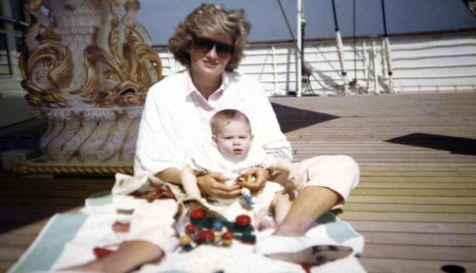 Princess Diana plays with Prince Harry on the Royal Yacht Britannia in a photograph taken by Prince William.