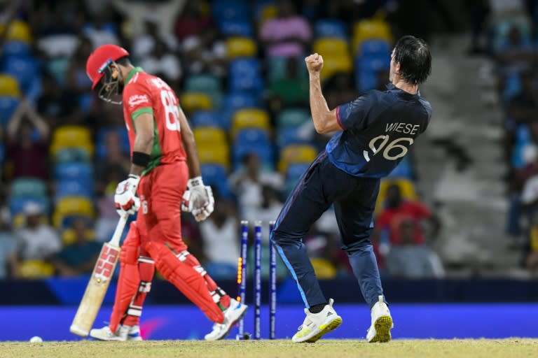 Oman's Naseem Khushi (L) is bowled by Namibia's David Wiese in the super over of their T20 World Cup clash on Sunday (Randy Brooks)