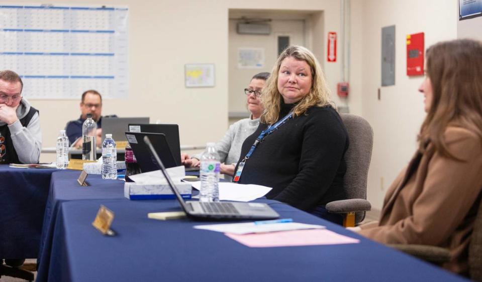 Jan Bayer, second from right, told the school board that the district’s facilities committee recommended asking the state for help repairing Valley View Elementary.