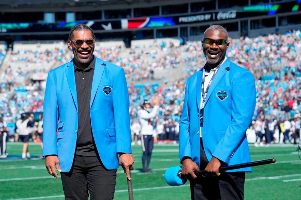 Former Carolina Panthers greats Julius Peppers and Muhsin Muhammad on the field before an October, 2023, game at Bank of America Stadium. (Bob Donnan-USA TODAY Sports)