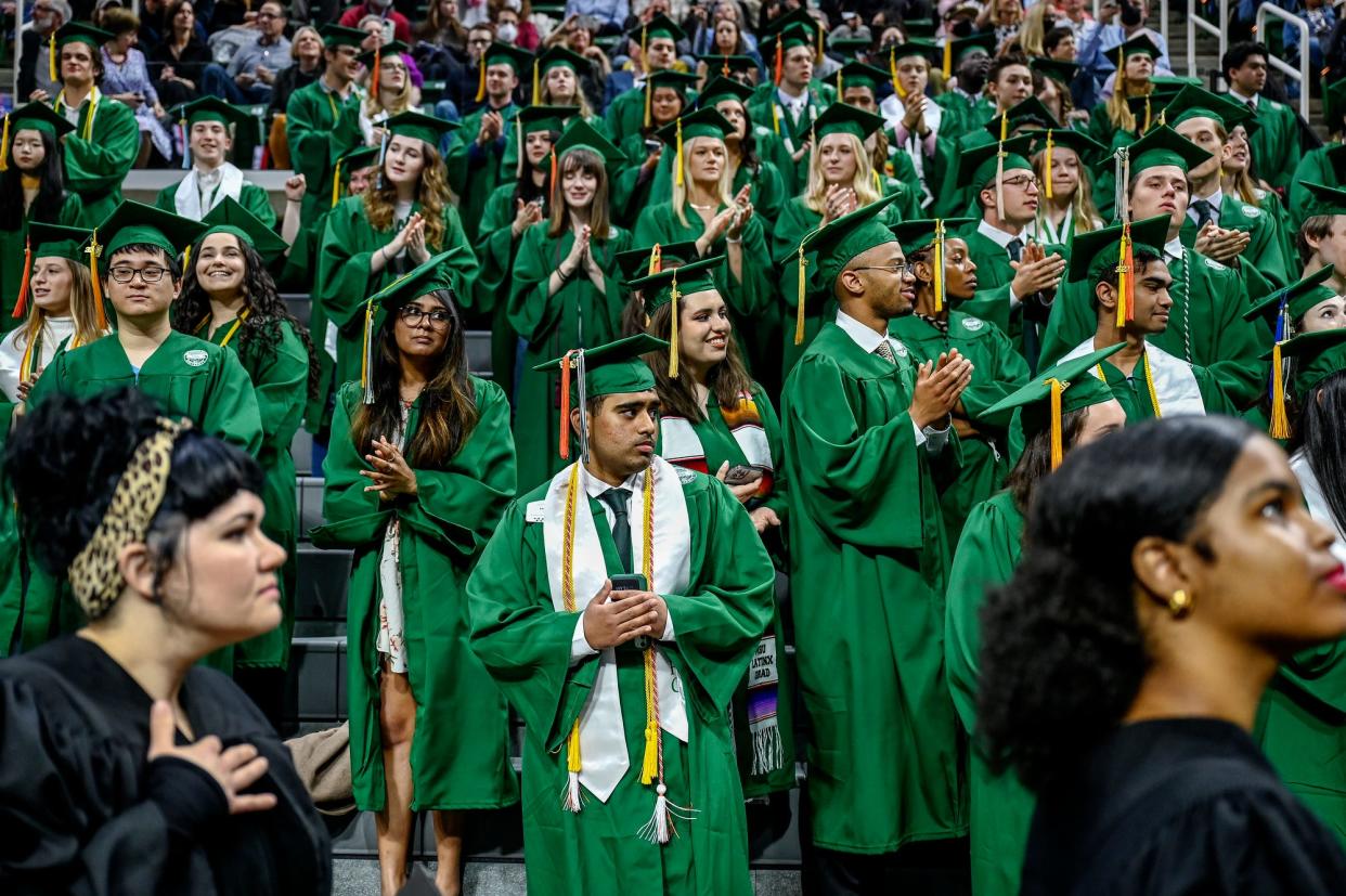 Graduates clap during the Michigan State University spring convocation on Friday, May 6, 2022, at the Breslin Center in East Lansing.