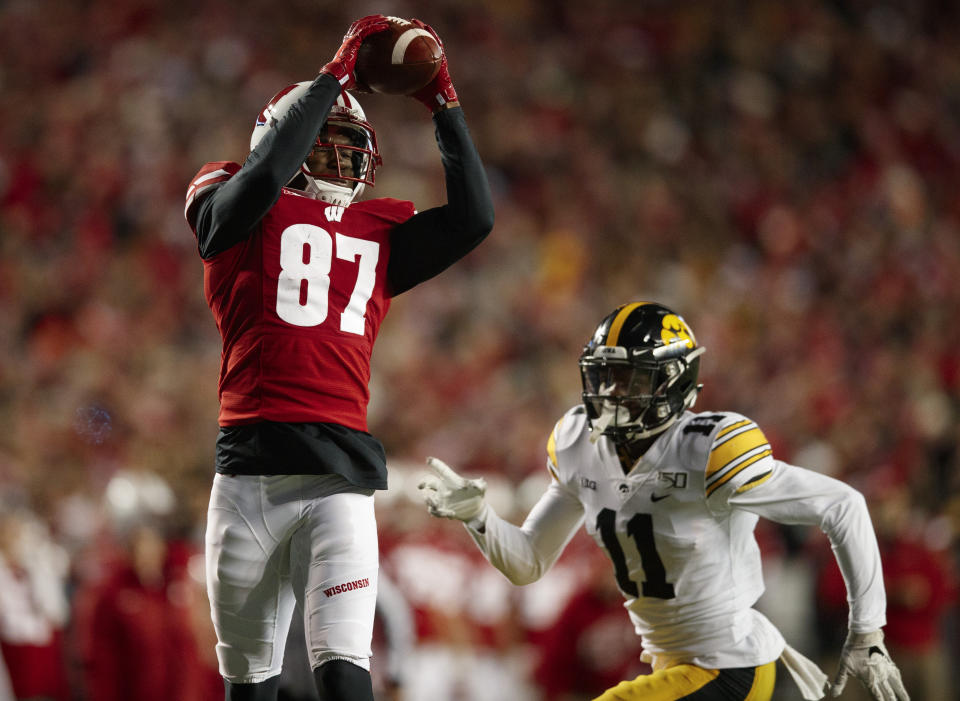 Nov 9, 2019; Madison, WI, USA; Wisconsin Badgers wide receiver Quintez Cephus (87) catches a pass in front of Iowa Hawkeyes defensive back Michael Ojemudia (11) during the third quarter at Camp Randall Stadium. Mandatory Credit: Jeff Hanisch-USA TODAY Sports