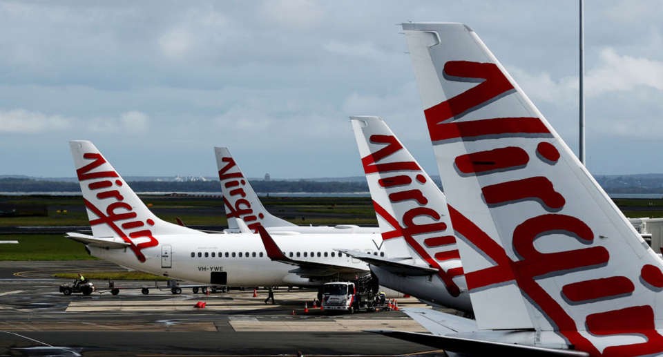 Virgin Australia aircrafts lined up beside on another at an airport after announcing pets could be allowed onboard domestic flights. 