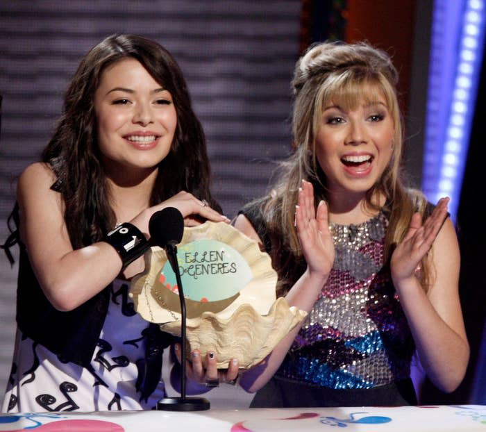 the two on stage presenting an award