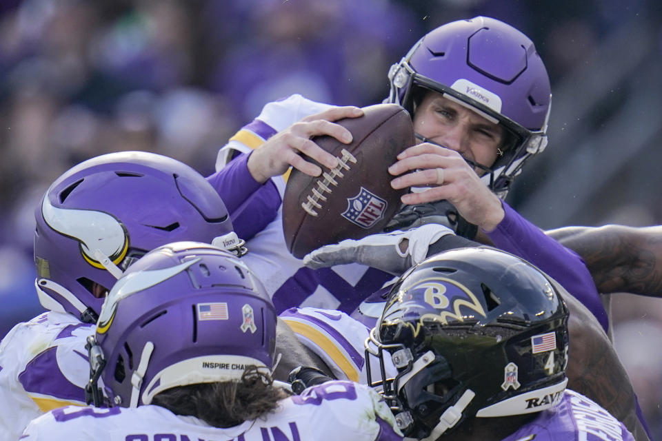 Minnesota Vikings quarterback Kirk Cousins (8) jumps up to score a touchdown during the first half of an NFL football game against the Baltimore Ravens, Sunday, Nov. 7, 2021, in Baltimore. (AP Photo/Julio Cortez)