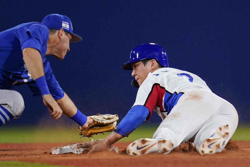 South Korea's Ji Hwan Oh, right, steals second base as Israel's Ian Kinsler covers the bag during a baseball game at the 2020 Summer Olympics, Thursday, July 29, 2021, in Yokohama, Japan. (AP Photo/Sue Ogrocki)