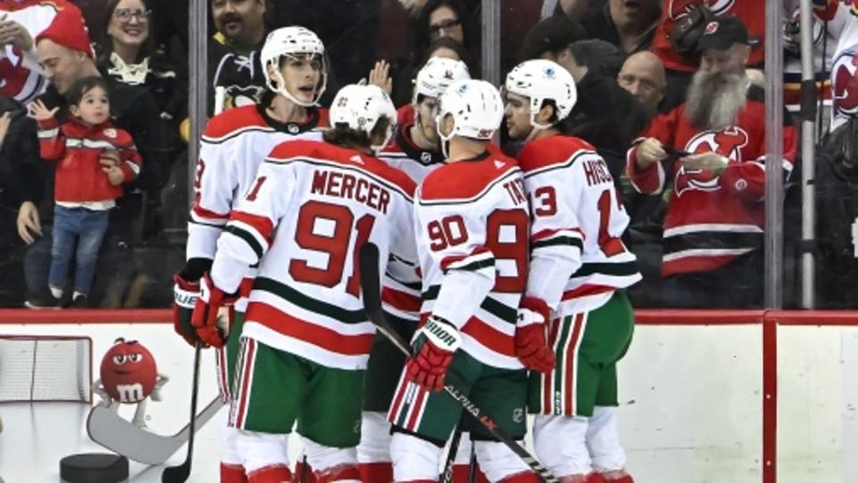 New Jersey Devils center Dawson Mercer (91) celebrates with teammates after scoring a goal against the Pittsburgh Penguins during the first period at Prudential Center