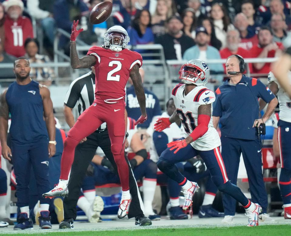 Dec 12, 2022; Glendale, Ariz., USA;  Arizona Cardinals wide receiver Marquise Brown (2) attempts to catch the ball against New England Patriots cornerback Jonathan Jones (31) during the second quarter at State Farm Stadium. Jones was called for pass interference on the play. Mandatory Credit: Michael Chow-Arizona Republic