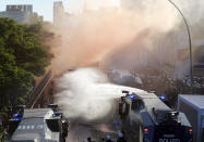 <p>Police uses water canons during a protest against the G-20 summit in Hamburg, northern Germany, July 6, 2017. The leaders of the group of 20 meet July 7 and 8. (AP Photo/Michael Probst) </p>